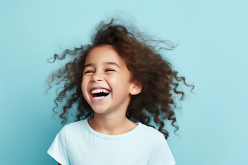 cute girl laughing cheerful isolated blue pastel color background