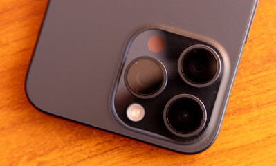 Close-up of a smartphone lying on a wooden table