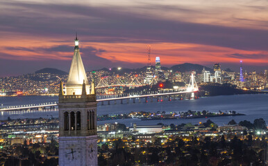 Sather Tower in UC Berkeley and San Francisco City Skyline at Sunset