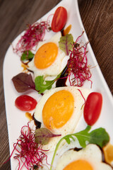 RECIPE FOR FRIED EGGS AND POMEGRANATE MOLASSES CUT INTO HEARTS, STARS AND FLOWERS. High quality photo