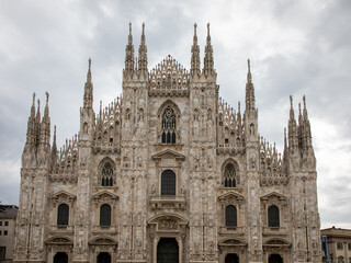 Fototapeta na wymiar Milan Cathedral Duomo facade European gothic style Cathedral in Italy