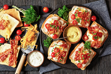 Kentucky Hot Brown open sandwiches on a plate - obrazy, fototapety, plakaty