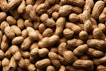 Top view food background of shelled roasted peanuts in heap