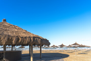Adriatic sea, Albania coast beautiful sky , Straw umbrella (Gjiri i Lalzit)