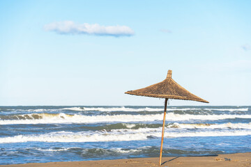 Adriatic sea, Albania coast beautiful sky , Straw umbrella (Gjiri i Lalzit)