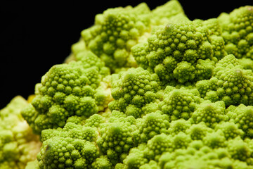 Close up detail shot of romanesco cauliflower with fractal spikes, copy space