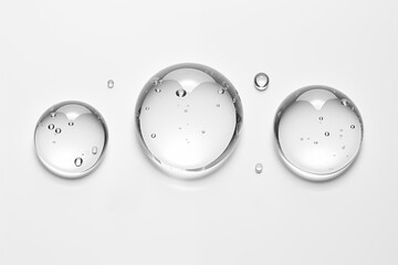 transparent drops collection colorless, different sizes, glycerin gel makeup with clear bubbles on white