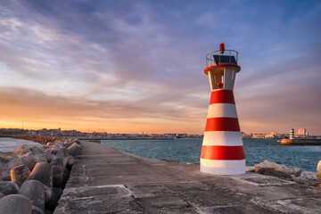 White and red lighthouse in Peniche, Portugal. - 686015618