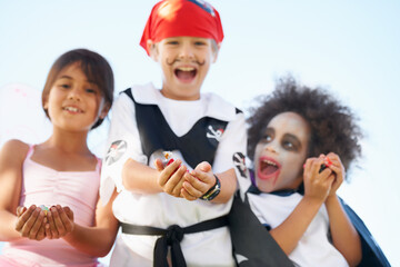 Children, halloween and costume or hands for candy asking as dracula dress up, fairy or pirate role...