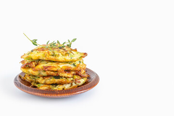 Cabbage Latkes or Sweet Potato Fritters for Jewish holiday Hanukkah on blue wooden background.	