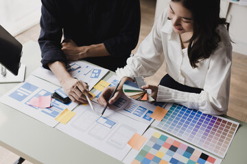 Business teamwork and working with UX developer and UI designer at table in modern office. Creative and development agency concept. - obrazy, fototapety, plakaty