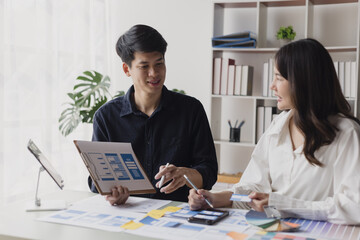 Obraz premium Business teamwork and working with UX developer and UI designer at table in modern office. Creative and development agency concept.