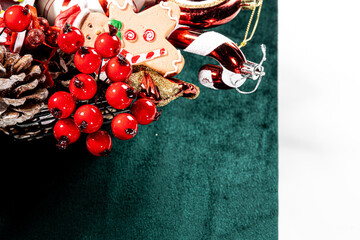 Basket full of Christmas elegant decorations on a green background