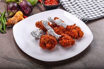 Indian cuisine glazed chicken lollipop