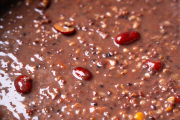close up of red rice porridge background. traditional food Laba porridge.