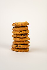Stack of cookies on white background,Front view of stacked chocolate chip cookies isolated on white