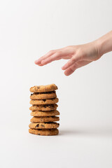 stack of cookies,Stack of cookies on white background,Front view of stacked chocolate chip cookies...
