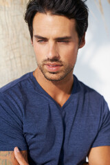 Obraz premium Thinking, man and outdoor in the sun with idea and calm with memory and modern style. Model, palm tree and contemplating with a relax person from California in the vacation sunshine with confidence