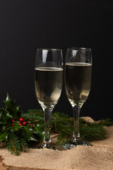 Celebrating the new year. Champagne on a black background. New Year background,Two glasses of champagne ready to bring New Year on a black background. Free text space.