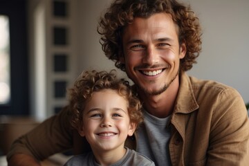 Close-up portrait of a beautiful family in nature. Dad and son with curly hair smile and look at the camera. Family Day, Day of Smiles, happiness, large family, family values concepts.
