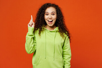 Young smart proactive woman of African American ethnicity she wears green hoody casual clothes...