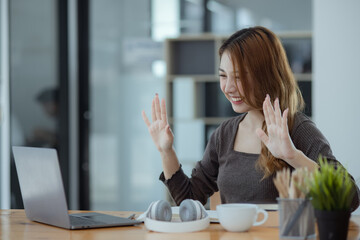 young asian woman and online education at desk.