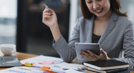 Asian Accounting Woman Working at Desk In Office. Business Financial and Accounting concept.