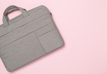 Grey stylish laptop bag on color background,top view