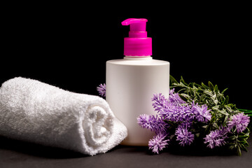 Obraz na płótnie Canvas Beauty treatment and relaxation concept.towels with soap and lavender background for beauty salon, beauty and aromatherapy,spa massage, lavender , soap on black background