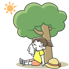 直射日光を避け木陰で休む女の子
