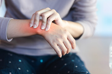 Women's wrist pain from using the hands to work repetitively for a long time or from general...