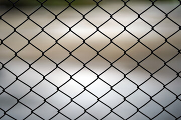 Close-up of wire mesh used as a cage or fence.