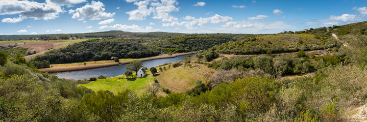 Naklejka premium still bay river valley a Mediterranean landscape of rolling hills and dry stone walls