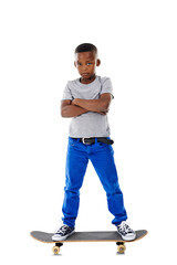 Naklejka premium Portrait, boy and skateboard with arms crossed, fashion and confident kid isolated on a transparent background. Person, model and child skating, activity and skater with a hobby, casual and png