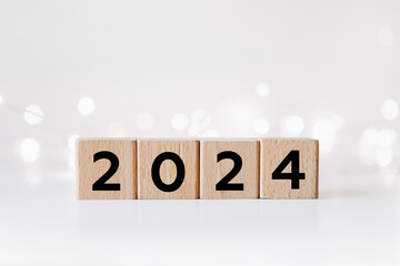 2024 New Year. Wooden blocks 2024 on white background. Start new year 2024 with goal plan, goal...