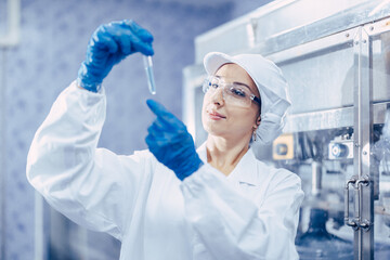 Industry scientist qc staff work checking testing quality of products water in drinking water plant...