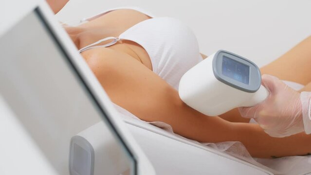 Hair removal-depilation. A young woman undergoes a laser hair removal procedure, close-up. Dermatology, photorejuvenation. Cosmetic clinic. Laser hair removal.