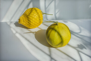 Two golden melons, fruits to eat for health.