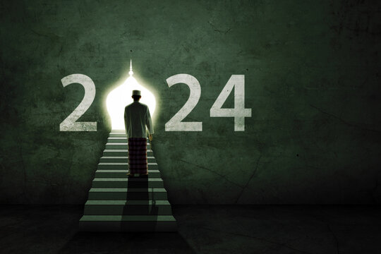 Muslim man standing on stairs and looking at door on 2024 on the wall