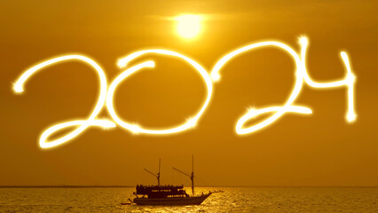 Silhouette of vintage sailboat sailing along the sea with a golden sunrise and a 2024 text on the...