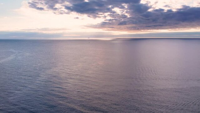4k Aerial drone fly over open sea. Sunset over Mediterranean Sea.