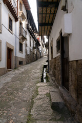 Beautiful streets of Candelario village with its white houses. Salamanca, Castilla y Leon, Spain.