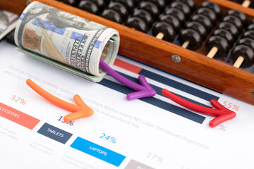 Financial trend arrows indicate direction