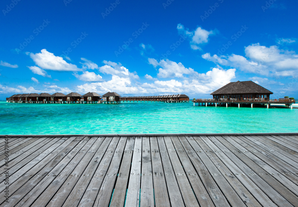 Sticker Beautiful tropical Maldives island with beach. Sea with water bungalows