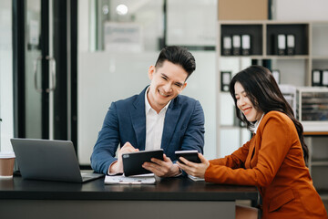 Portrait of success business people working together in modern office. Couple teamwork startup concept.
