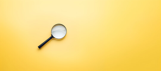 A magnifying glass isolated on yellow background