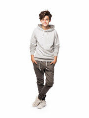 Naklejka premium Pretty happy teenage boy in full growth. Isolated on white background