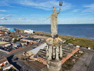 Britannia Monument, Nelson's great Yarmouth UK drone,aerial  windfarm in background