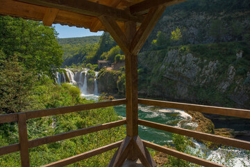 A viewing platform overlooking Strbacki Buk, a terraced waterfall on the Una River on the border...