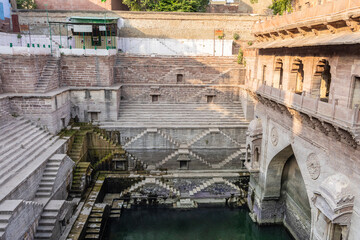 ancient red stone unique stepwell architecture at day from different angle